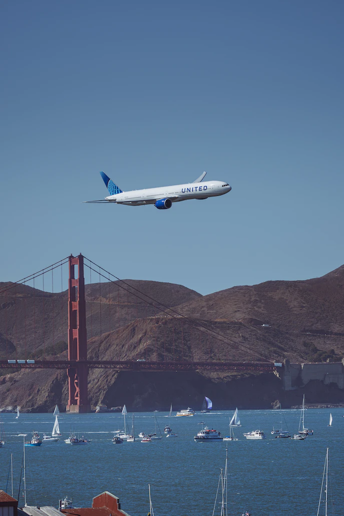 Photo of United jet over the Golden Gate Bridge